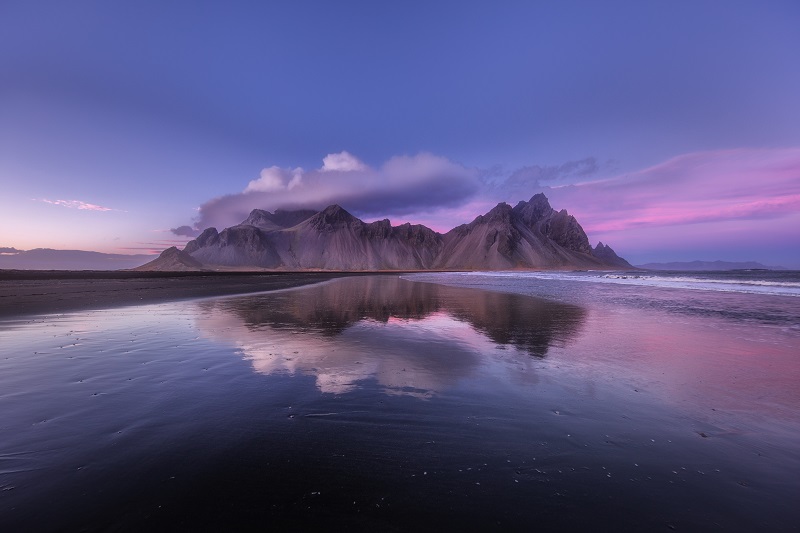 mountains on the beach with purple sky in iceland